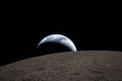 Earthrise over the lunar horizon